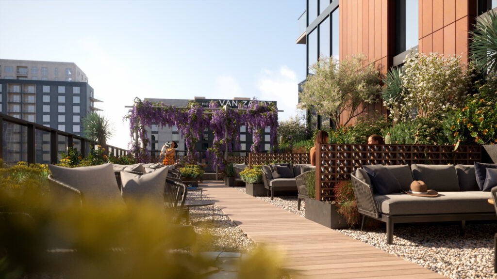 Vesper ATX Condos' amenity deck featuring a pet-friendly dog walk area surrounded by lush greenery, ideal for pet owners in downtown Austin.