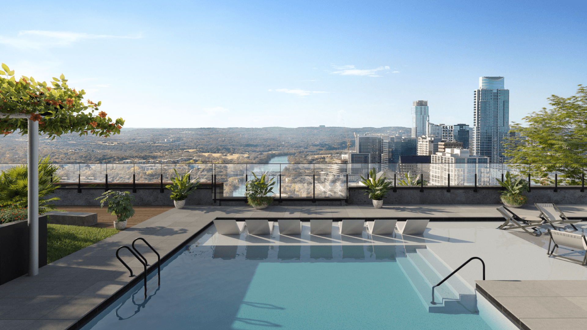 Luxurious rooftop pool at Vesper ATX on Rainey Street overlooking the Austin skyline with loungers and scenic hill country backdrop.