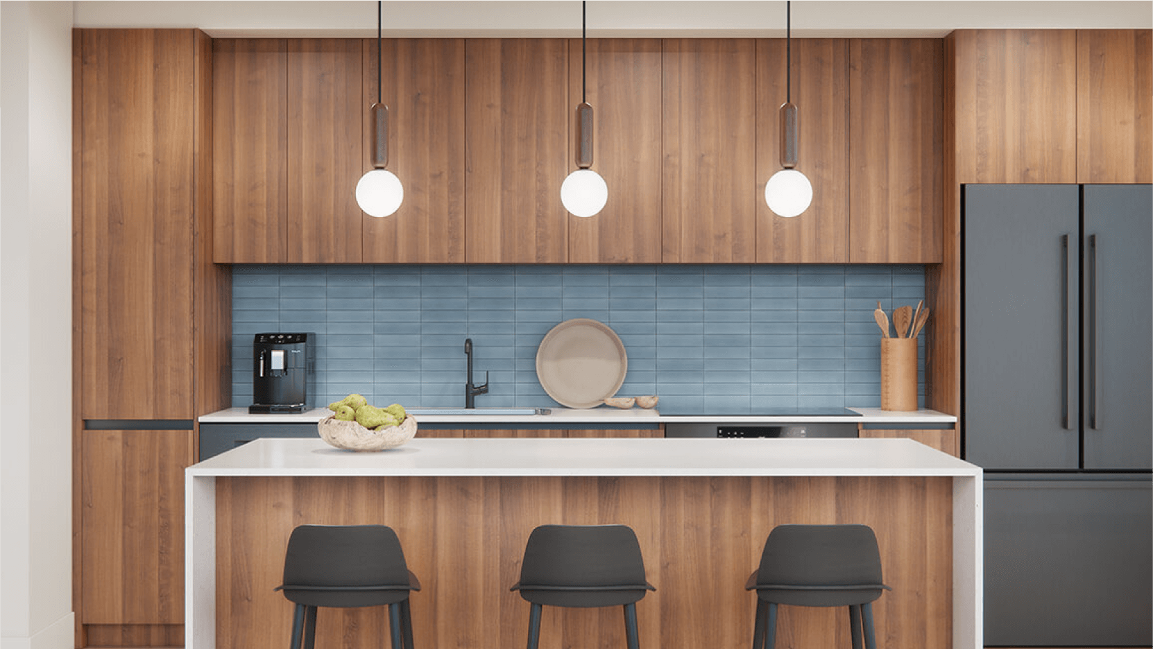 Contemporary kitchen in Vesper ATX condos with wooden cabinets, blue subway tile backsplash, and white pendant lighting over a breakfast bar.