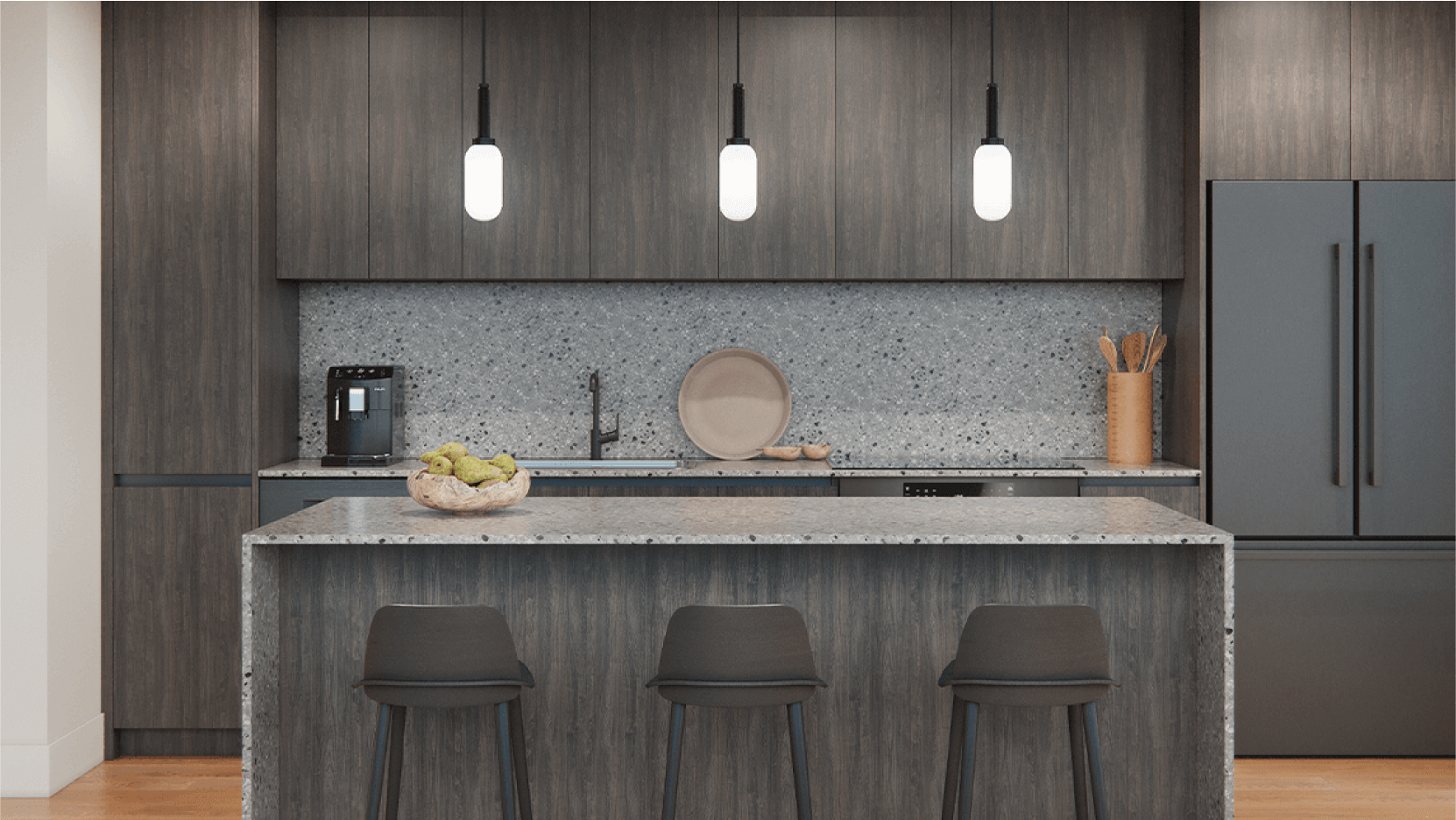 Vesper ATX has stylish modern kitchens with a spacious breakfast bar, elegant pendant lights, and dark wood cabinets, set in a downtown Austin luxury condo.