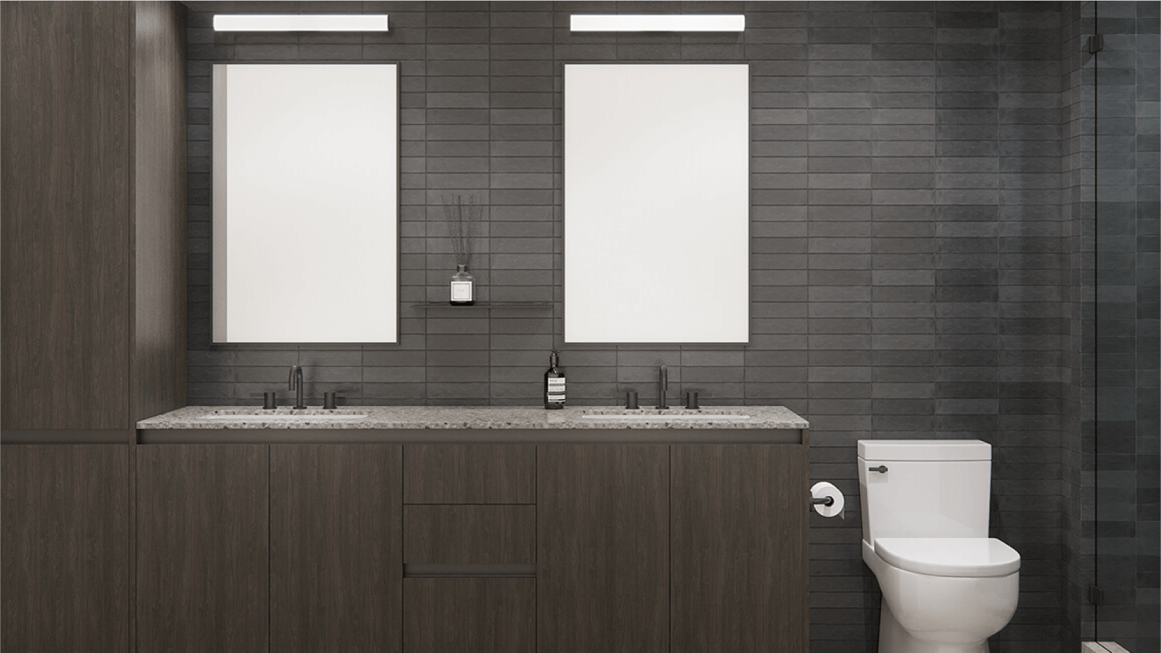 Sleek and stylish bathroom interior at Vesper ATX with charcoal gray tiles, featuring twin rectangular mirrors with LED lighting above a dual sink vanity, complemented by dark wood cabinetry and modern matte black faucets.