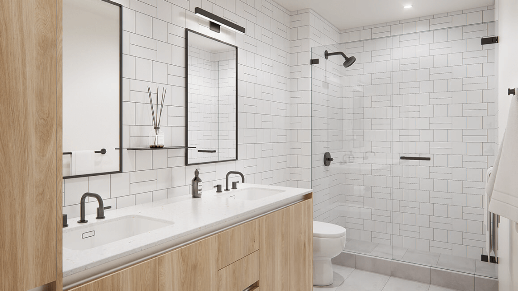 Chic and minimalist bathroom interior at Vesper ATX condos with a double vanity, subway tile walls, black hardware, and a spacious walk-in shower, reflecting luxury urban living.