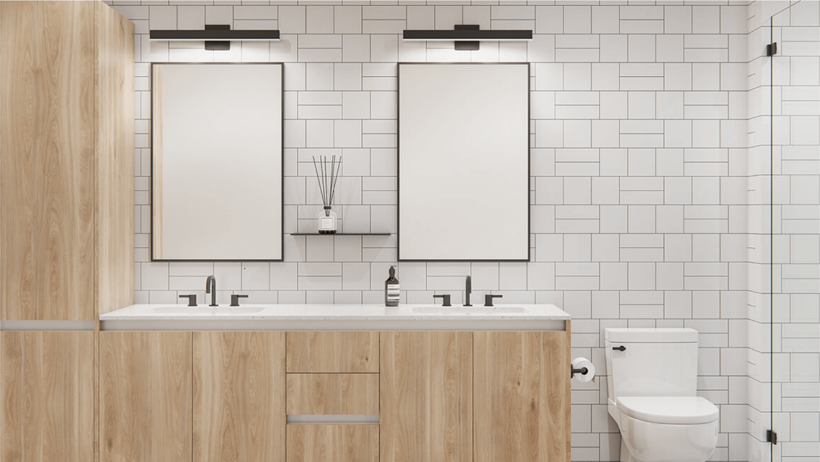 Contemporary bathroom showcasing a sleek design with light wooden vanity, white subway tiles, black framed mirrors, and minimalist decor.