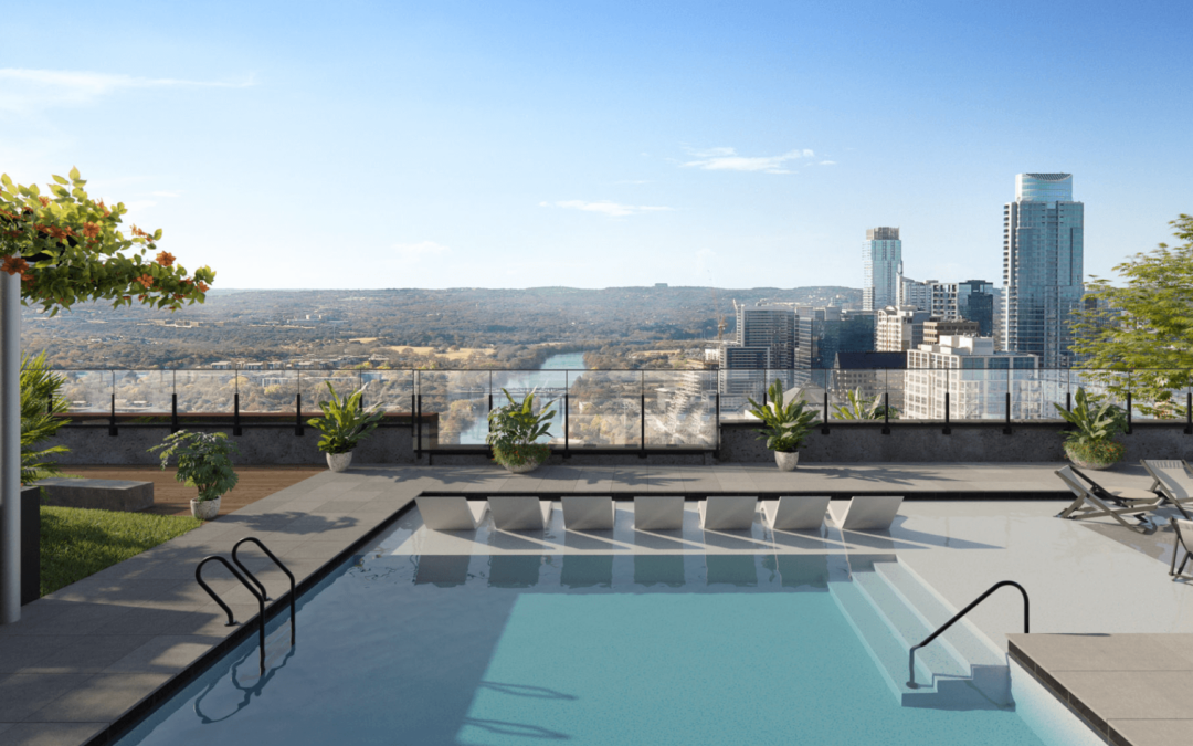 Luxurious rooftop pool at Vesper ATX on Rainey Street overlooking the Austin skyline with loungers and scenic hill country backdrop.